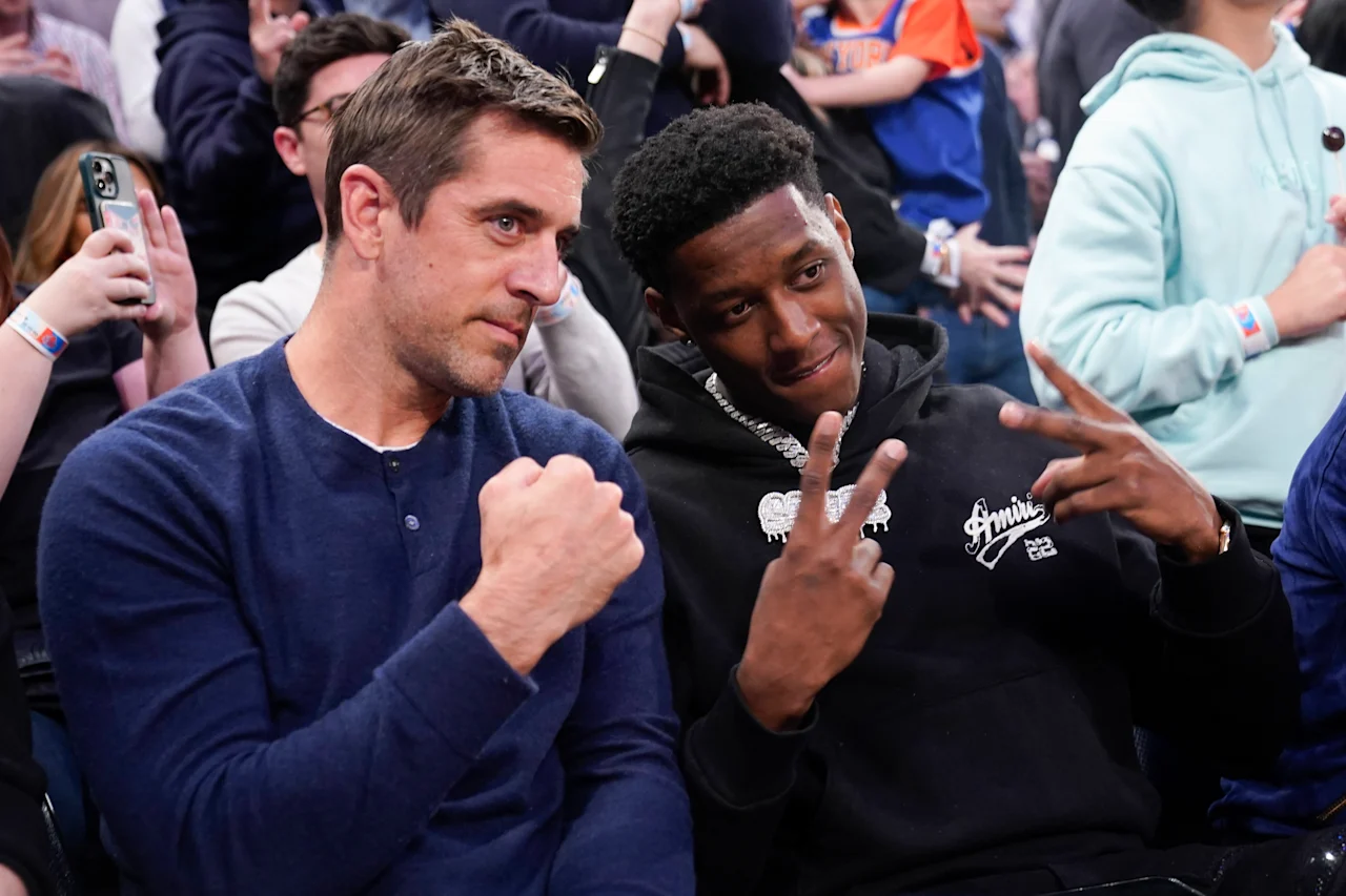 Aaron Rodgers and Sauce Gardner