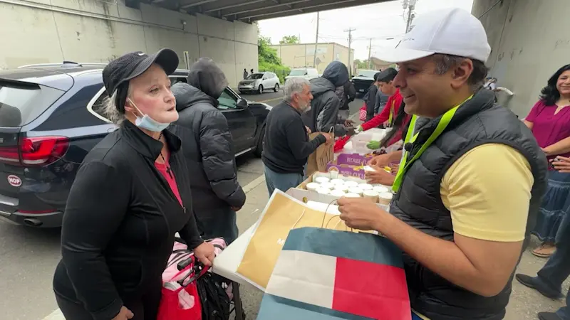Story image: ‘How lucky we are.’ Trumbull dad, family spend Father’s Day serving food in Bridgeport