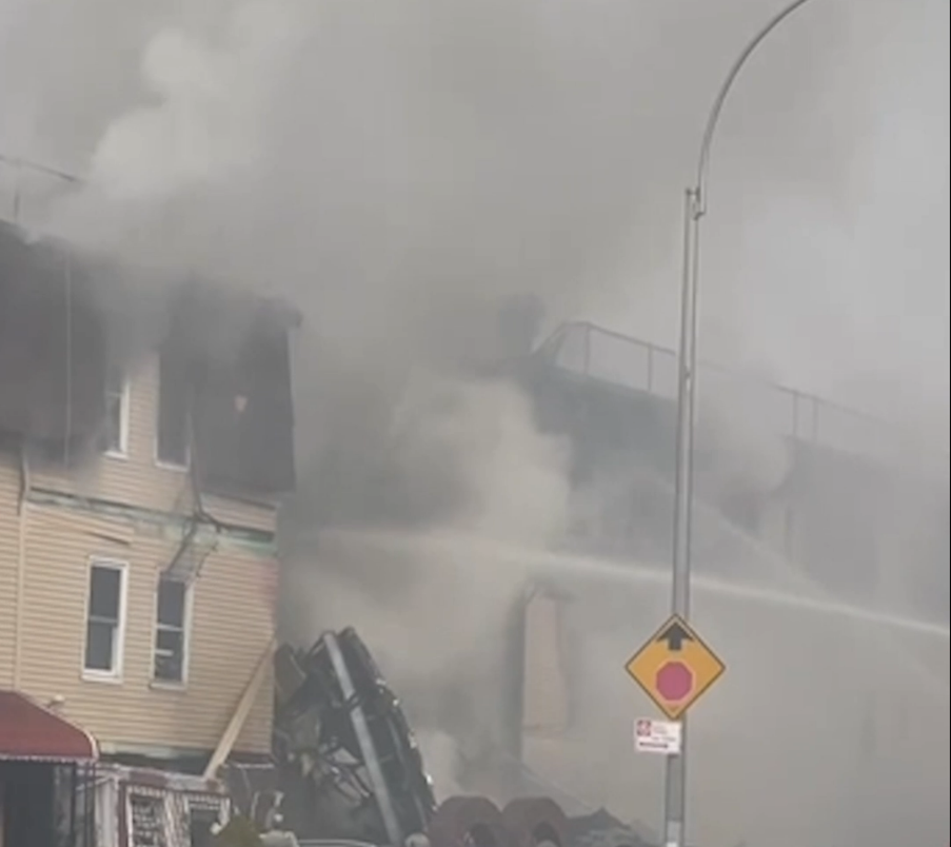 Massive Fire Causes Partial Building Collapse; 77-year-old Woman Dead