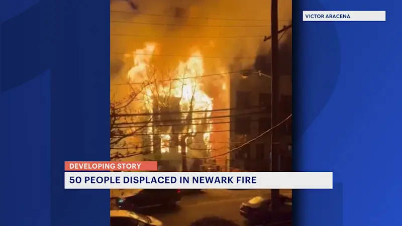 Story image:  3-alarm fire that spread to Newark buildings displaces at least 50 people