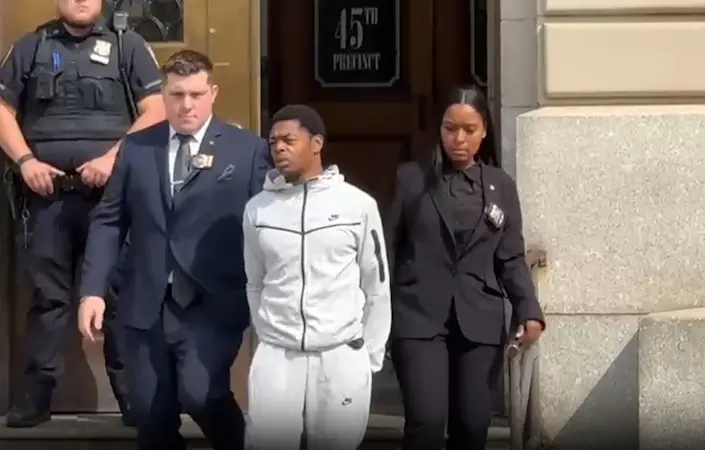 Story image: Suspect charged in attack on NYPD officer faces judge in The Bronx