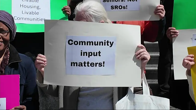 Story image: Pelham Parkway residents rally at City Hall against proposed supportive housing