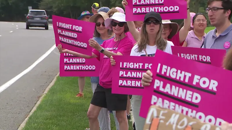 Story image: More than 50 protest outside Rep. Lawler’s office over proposed Planned Parenthood cuts