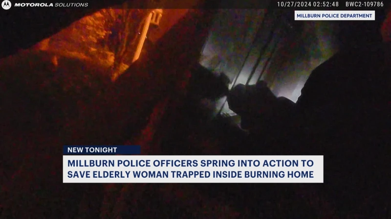 Story image: Caught on camera: 3 Millburn officers rescued elderly woman from burning home