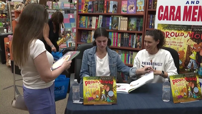 Story image: Actress Idina Menzel, sister Cara Menzel hold signing at Northvale bookstore