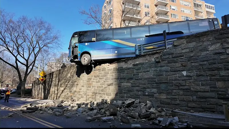 Story image: MTA bus dangles off overpass near Henry Hudson Parkway