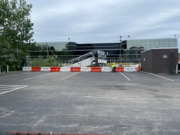 Story image: Crews start work on removal of bus from partial garage collapse in North New Hyde Park
