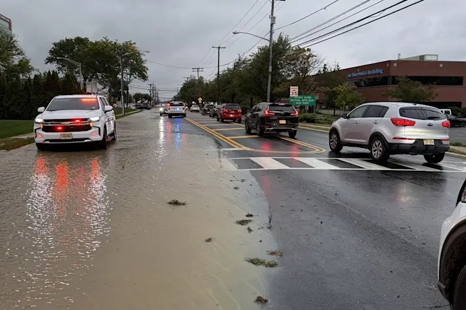 Story image: Neptune driver hits hydrant near hospital entrance, causing flooding and delays