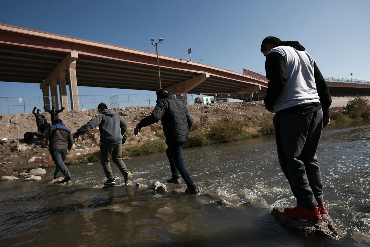 Migrants walk towards the U.S.-Mexico border in Ciudad Juarez, Mexico, Monday, Dec. 19, 2022. Pandemic-era immigration restrictions in the U.S. known as Title 42 are set to expire on Dec. 21. (AP Photo/Christian Chavez)