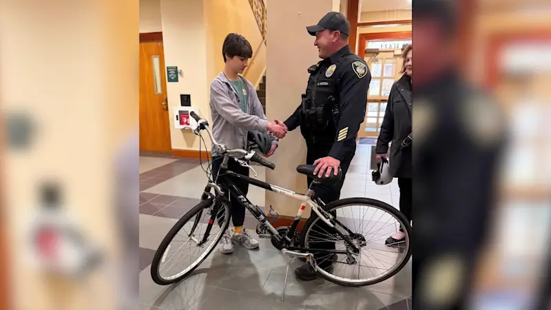Story image: Jersey Proud: Summit police officer gifts bike to boy whose bike was stolen