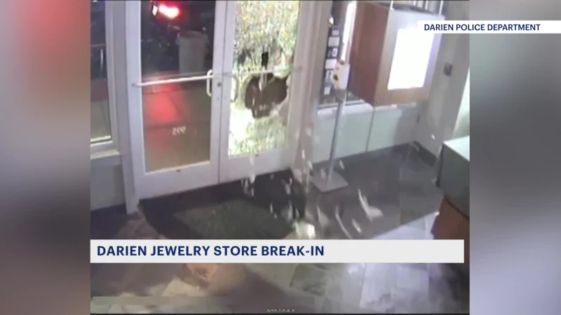 Story image: Caught on camera:  Masked thieves seen robbing, ransacking Darien jewelry store