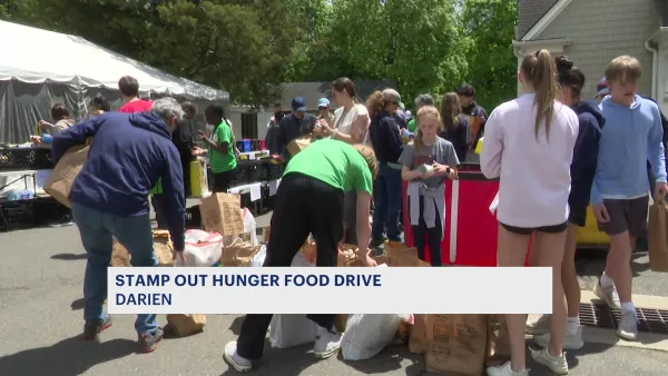 Volunteers and mail carriers work to ‘Stamp Out’ hunger in Connecticut