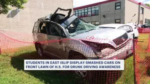 Students in East Islip display smashed cars on front lawn of high school for drunk driving awareness