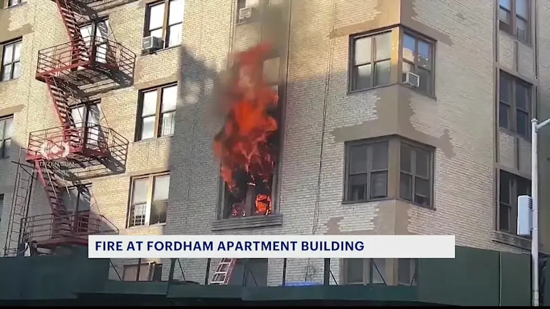 Story image: Citizen video shows child rescued from Fordham blaze that left 12 people injured
