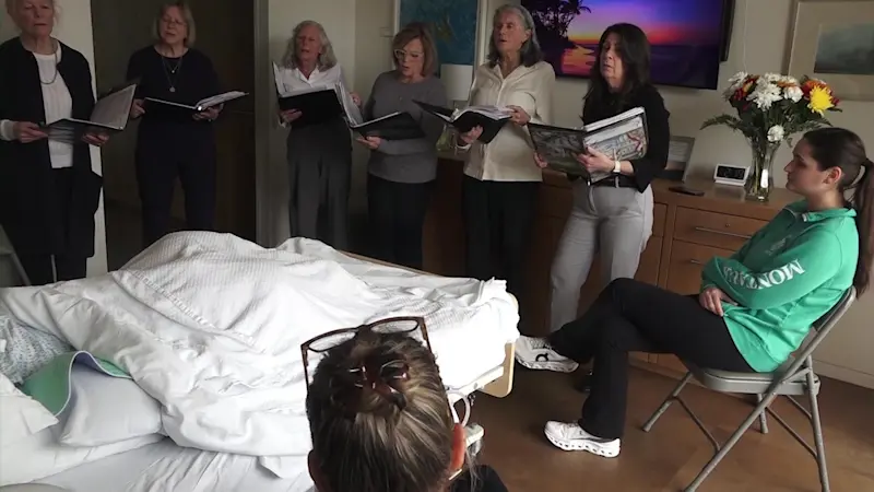 Story image: East End Threshold Singers sing to hospice patients and their families  