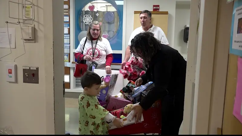 Story image: Roses and toys handed out to Maimonides Medical Center PICU families for Valentine's Day