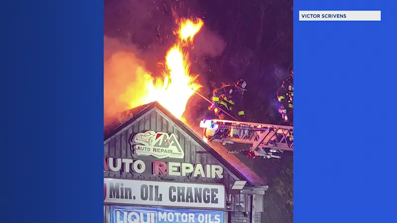 Story image: Flames rip through auto repair shop in Clifton 