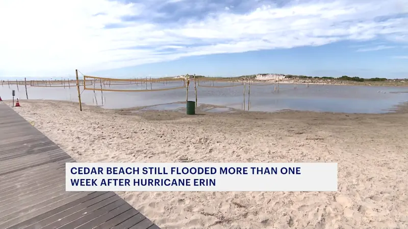 Story image: Volleyball courts at Cedar Beach remain flooded