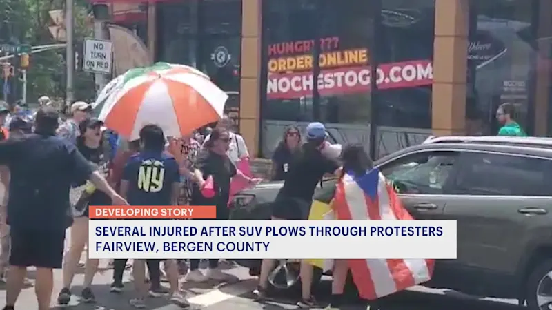 Story image: Police: Woman drives into crowd of protesters blocking Fairview intersection following altercation