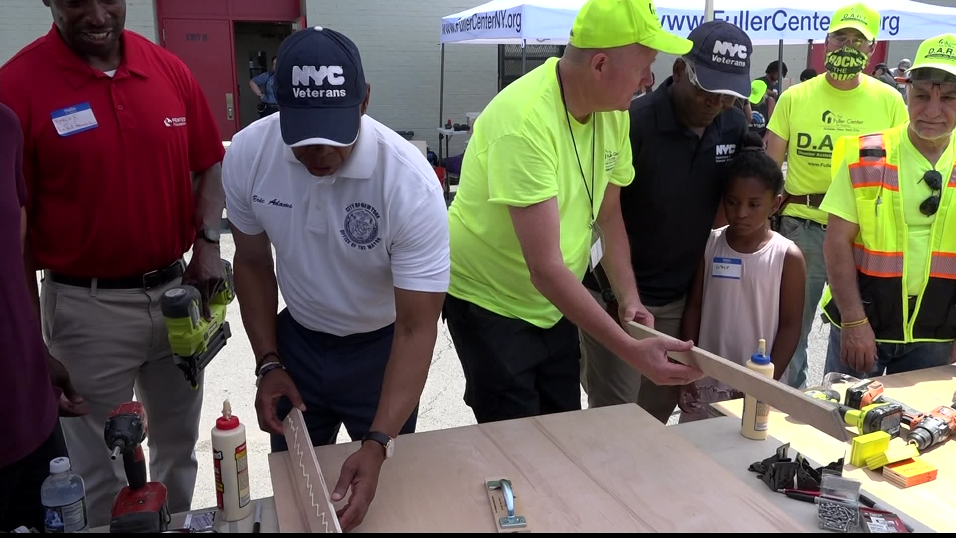 Mayor Adams joins volunteers to build furniture for veterans in need