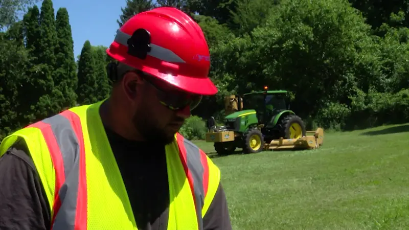 Story image: Long Islanders working outside take extra precautions amid heat wave