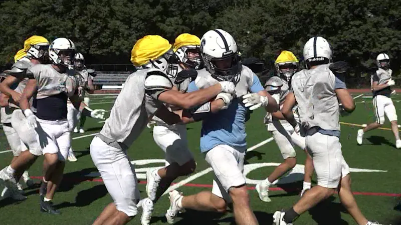 Story image: 'Back with the boys.' CT high school football season starts next week