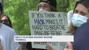 Activists gather on Town Hall Green in Trumbull to discuss ways to tackle racism
