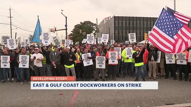 Story image: Dockworkers at ports from Maine to Texas go on strike, a standoff risking new shortages