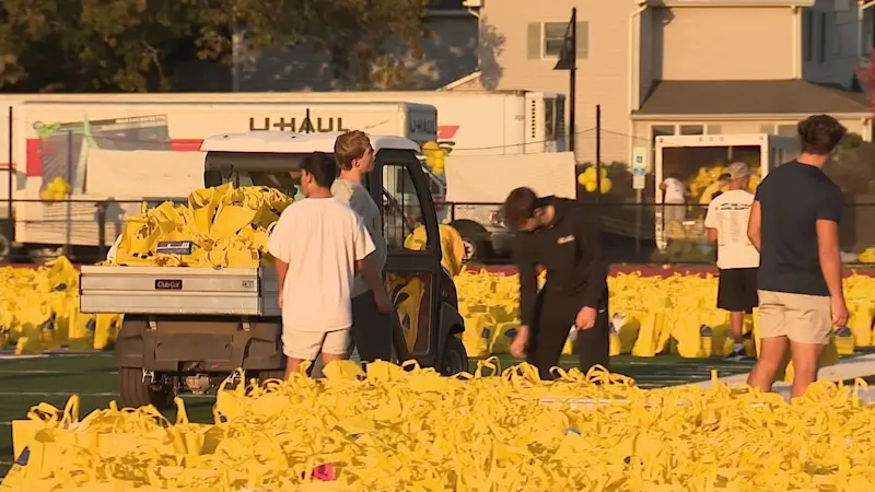 Story image: 100-yard challenge: Rumson high school fills football field with food donations ahead of SNAP benefit cutoff deadline 