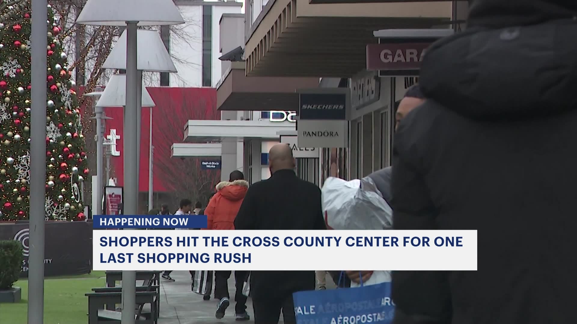 Last minute Christmas shoppers make their way to Cross County Center in 