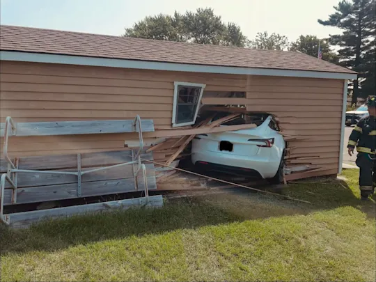 CAR INTO SHED 