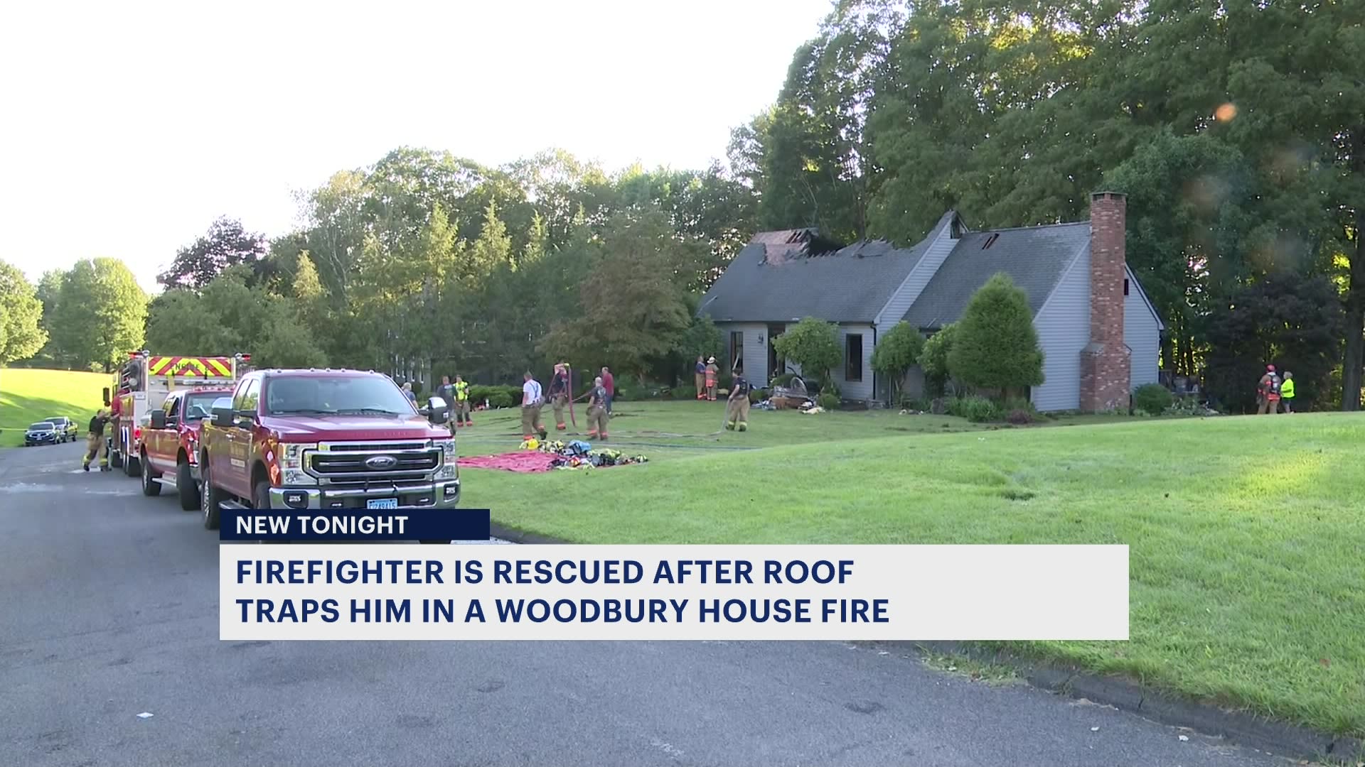 Firefighter rescued following roof collapse during Woodbury house fire