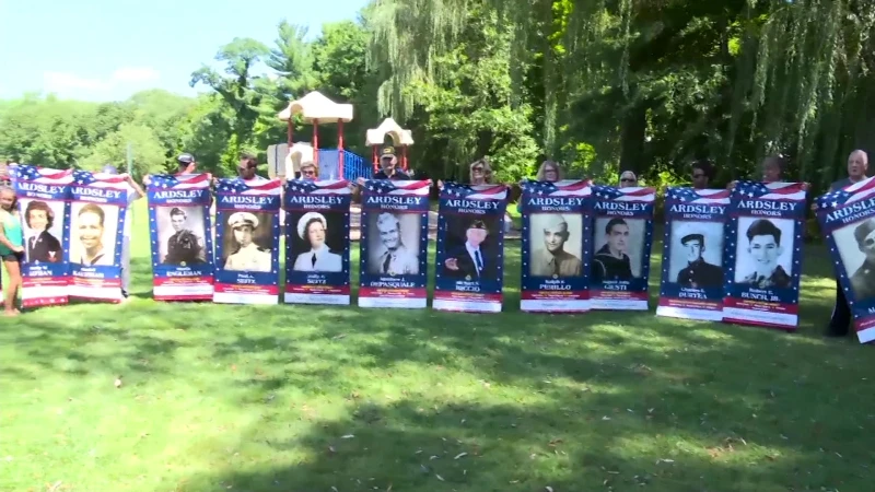 Story image: Girl Scouts in Ardsley honor veterans during inaugural banner walk