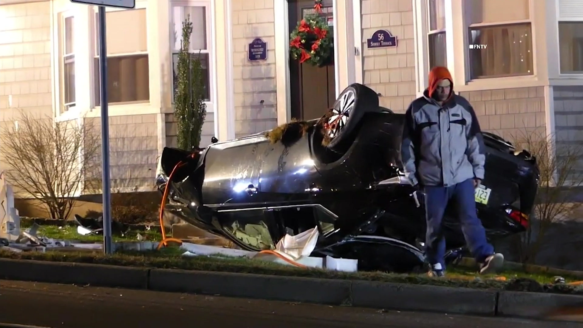 Car crashes into Wayne home, rolls over on lawn