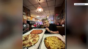 Chef Ramsay takes a bite of New Haven pizza