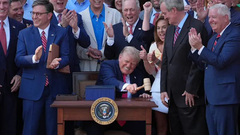 Story image: Trump signs his tax and spending cut bill at the White House July 4 picnic