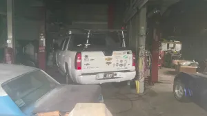 Cars stuck inside Garden City Park shop following owner's death