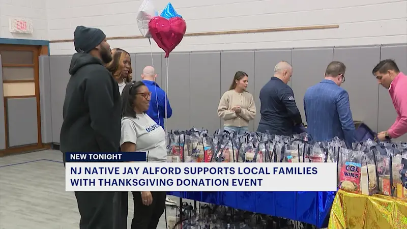 Story image: Super Bowl champ Jay Alford, NY Giants hand out Thanksgiving meals in Newark