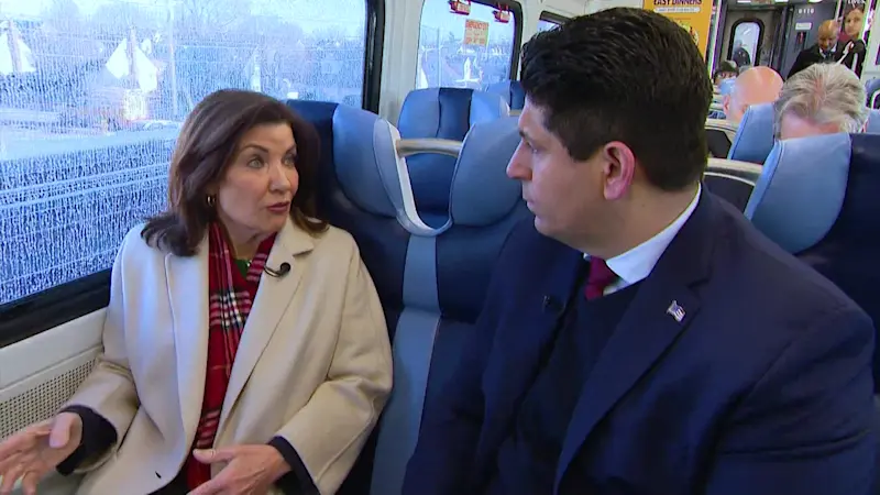 Story image: News 12's Rich Barrabi discusses congestion pricing with Gov. Hochul aboard the LIRR