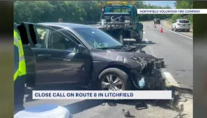 'A near miss.' Northfield firefighters plead with drivers to be more cautious after car crashes into DOT truck in Litchfield