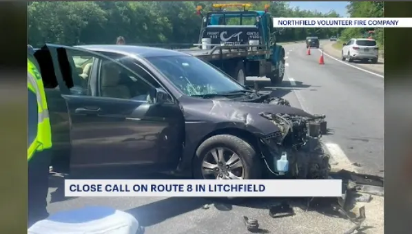 'A near miss.' Northfield firefighters plead with drivers to be more cautious after car crashes into DOT truck in Litchfield