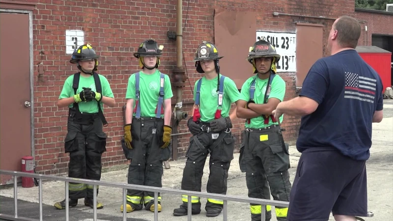 Story image: Teens learn skills needed to become firefighters at Camp Fahrenheit 516 