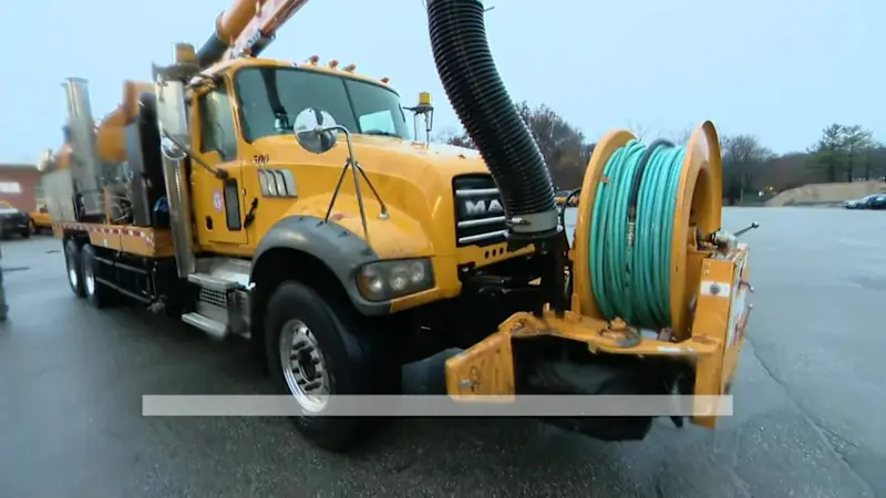 Story image: Town highway crews in Huntington working to prevent flooding from storm