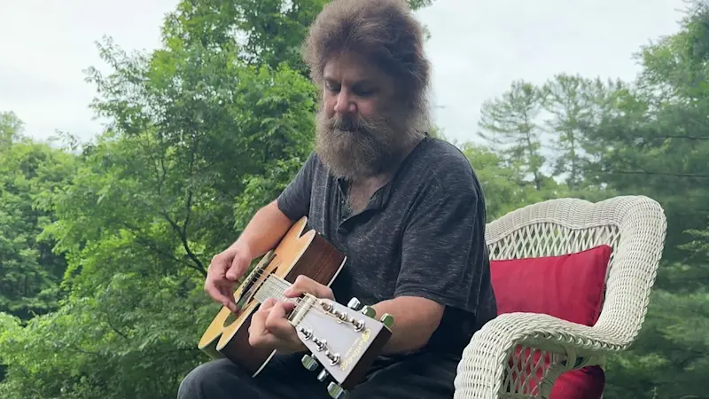 Story image: New Milford musician gifts guitars to children