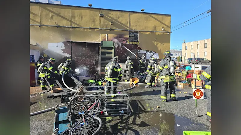 Story image: Firefighters battle cold, wind in blaze behind Hackensack food market