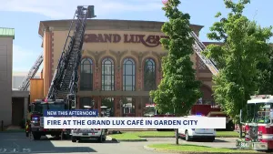 Officials: Firefighters work to put out kitchen fire at Grand Lux Café