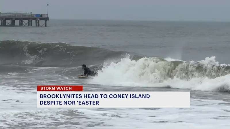Story image: Brooklyn residents enjoy Coney Island Beach during nor'easter