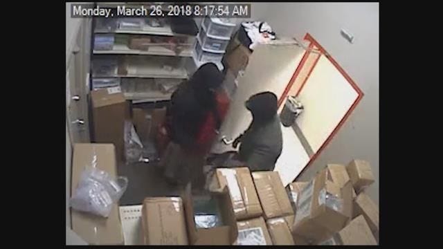 Surveillance video shows 2 armed men robbing $350K from