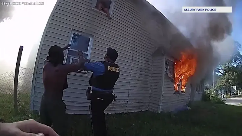 Story image: Bodycam shows responders catch child who jumped from burning Asbury Park home
