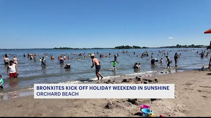 Story image: Bronx residents kick off holiday weekend in the sunshine at Orchard Beach